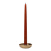 Tall rust-colored candle in a simple gold holder. Elegant design with smooth, solid colors. Perfect for decor.