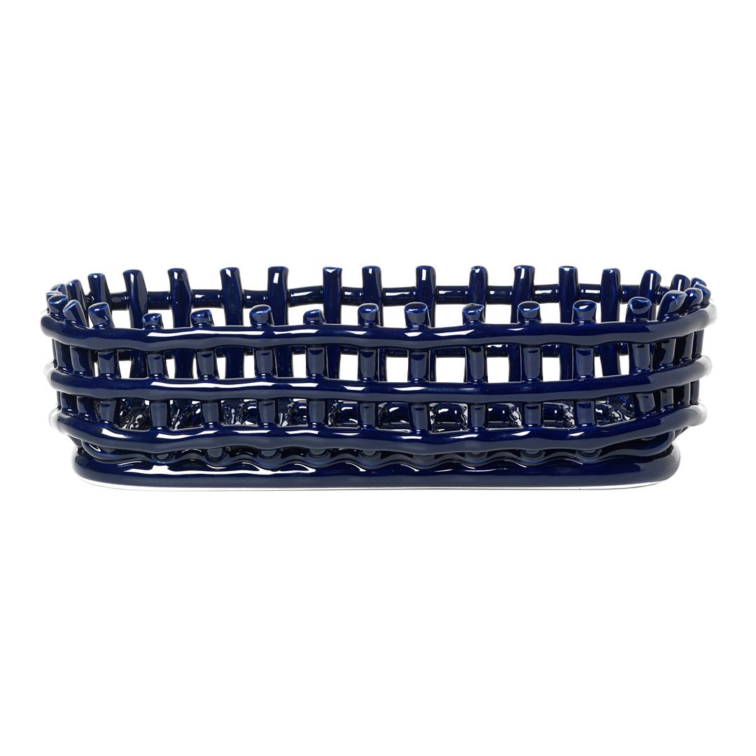 Navy blue braided basket with woven pattern, perfect for decor or storage.