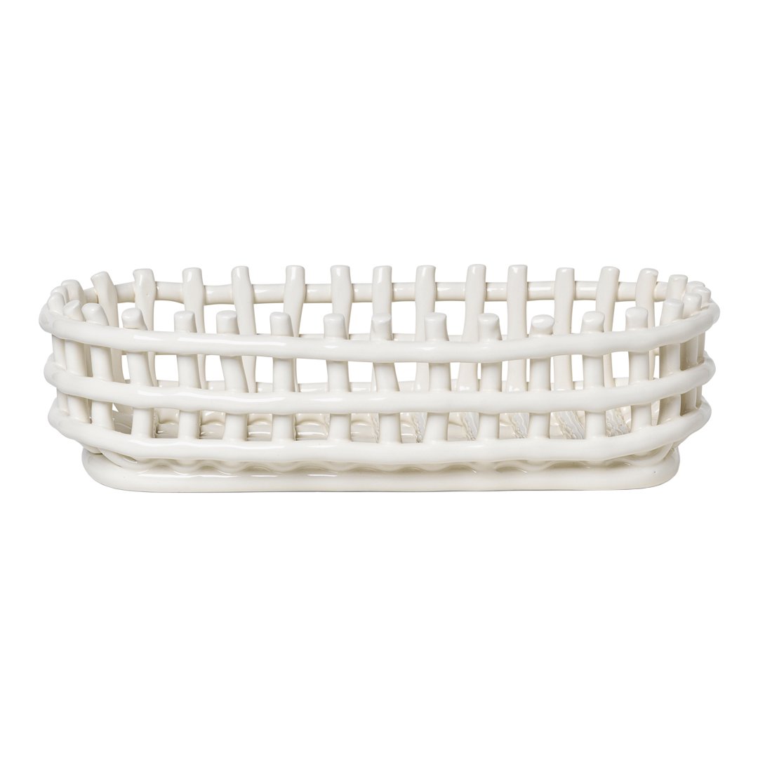 White woven basket with an oval shape and open lattice design, perfect for storage and decor.