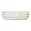 White woven basket with an oval shape and open lattice design, perfect for storage and decor.