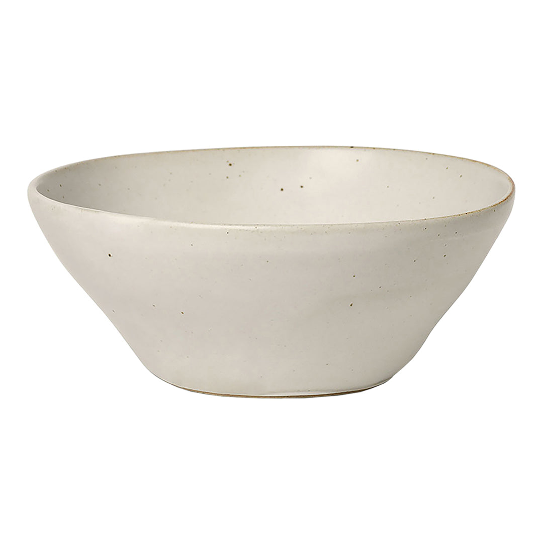 Neutral beige ceramic bowl with subtle speckles and a smooth, matte finish. Ideal for modern dining decor.