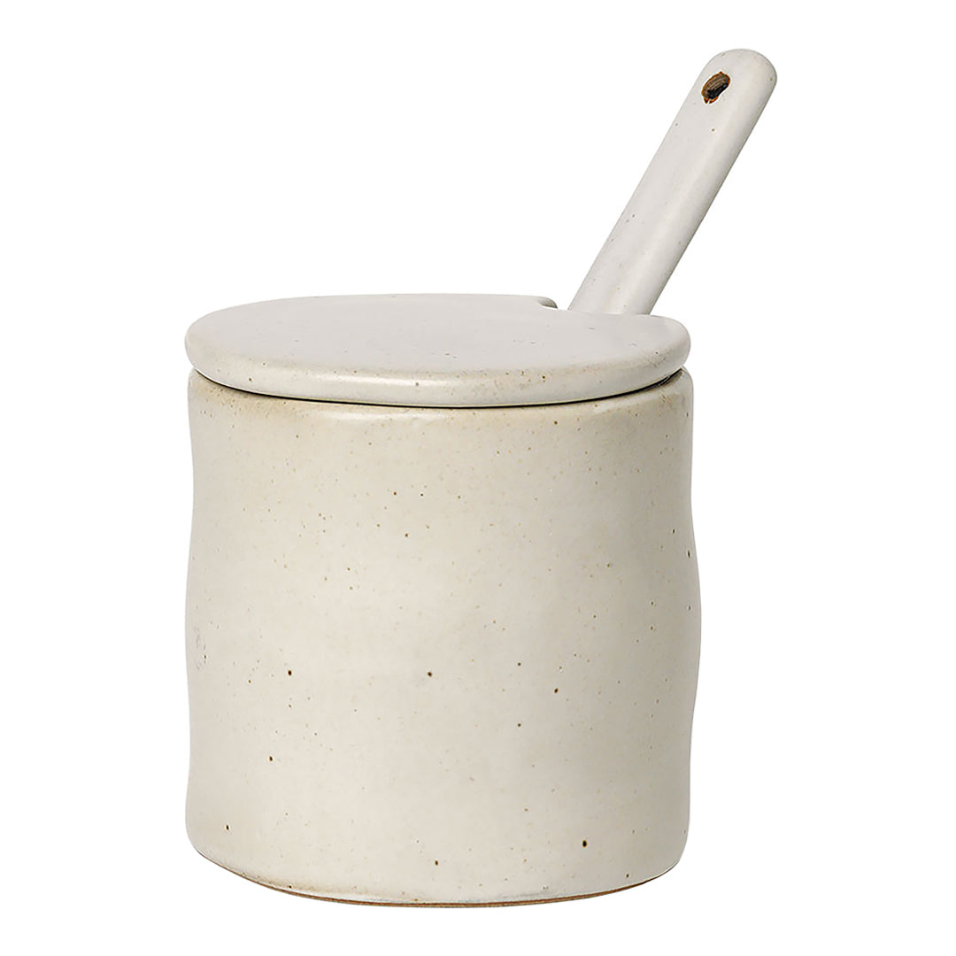 Cream ceramic jar with a smooth matte finish and white lid, featuring a minimalist design. Ideal for kitchen storage.