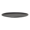 Round black ceramic plate with a smooth, glossy finish and subtle shading variations. Perfect for modern dining.