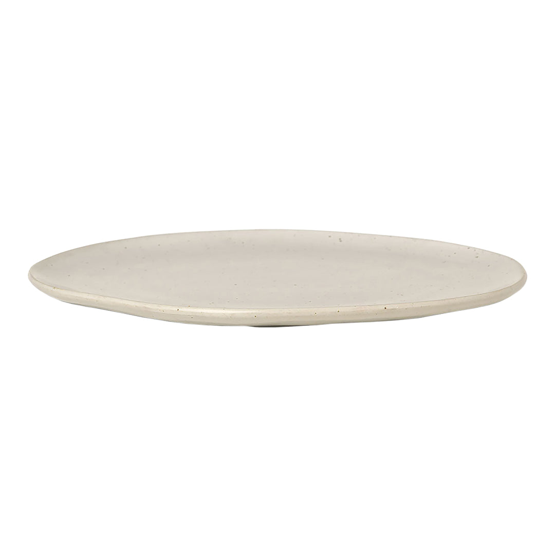 Cream-colored ceramic plate with a smooth, matte finish and minimalistic design. Ideal for modern table settings.