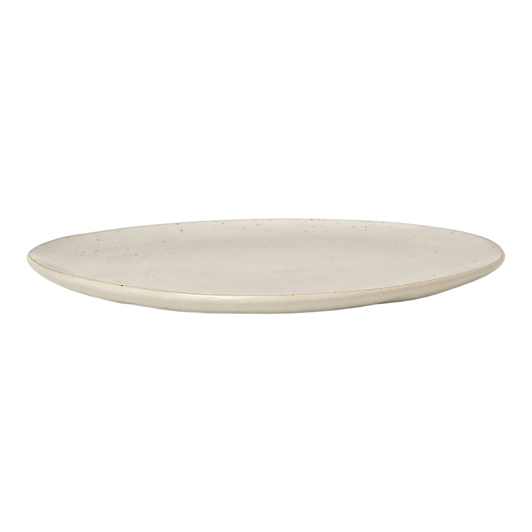 Cream-colored ceramic plate with a smooth, matte finish and subtle textured edges. Perfect for elegant dining.