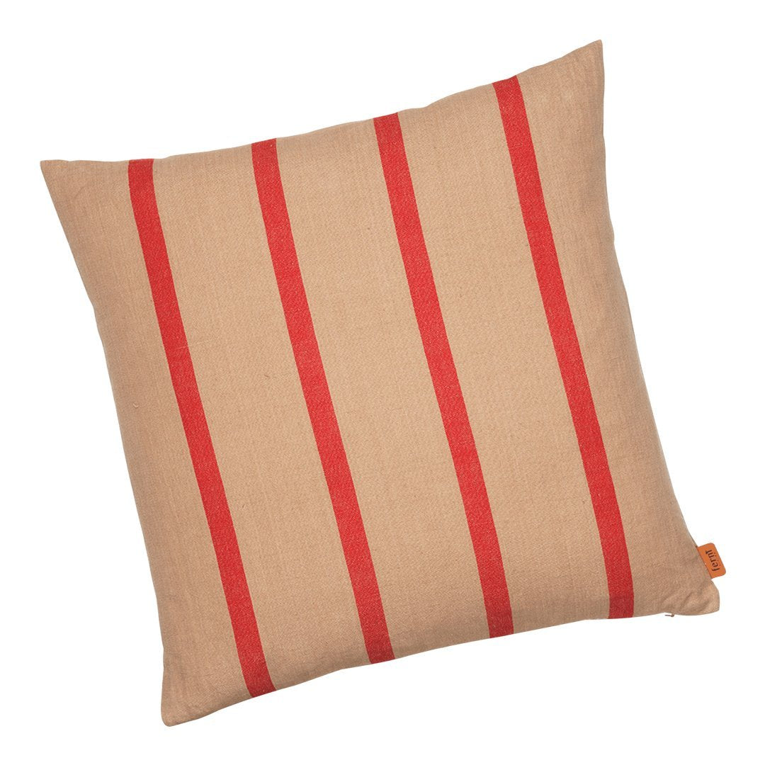 Tan pillow with bold red stripes, perfect for adding a pop of color and style to any space.
