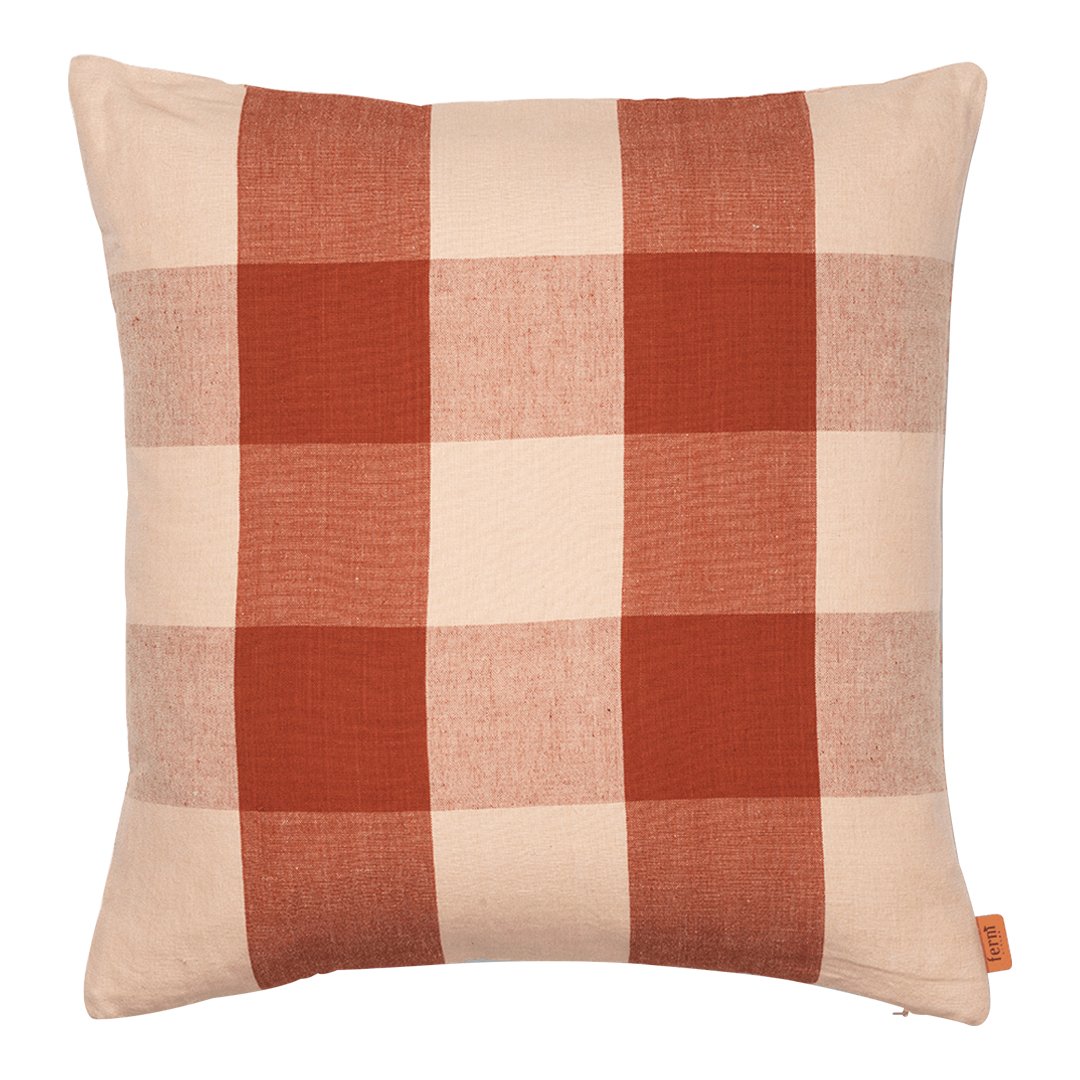 Rustic terracotta and cream checkered pattern pillow, perfect for cozy home decor accents.