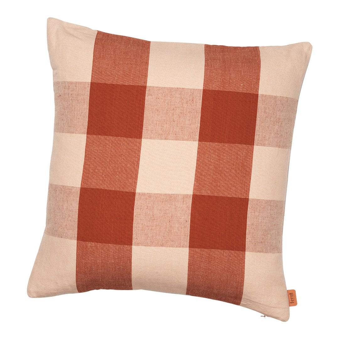 Rust plaid throw pillow in warm terracotta and soft beige, featuring a stylish checkered pattern. Ideal for home decor.