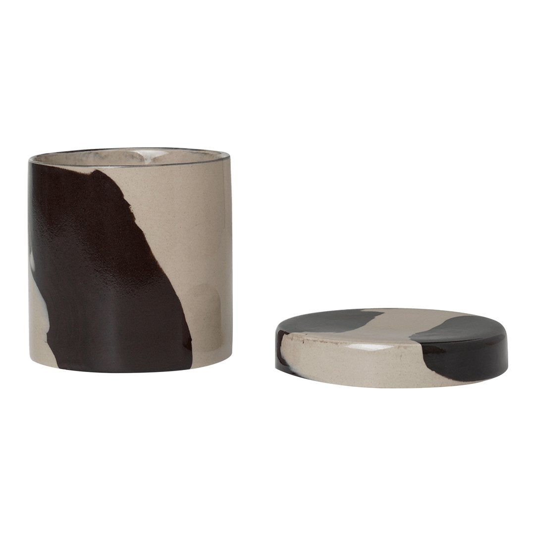Ceramic container with an abstract black and beige pattern, featuring a smooth finish and a matching lid.