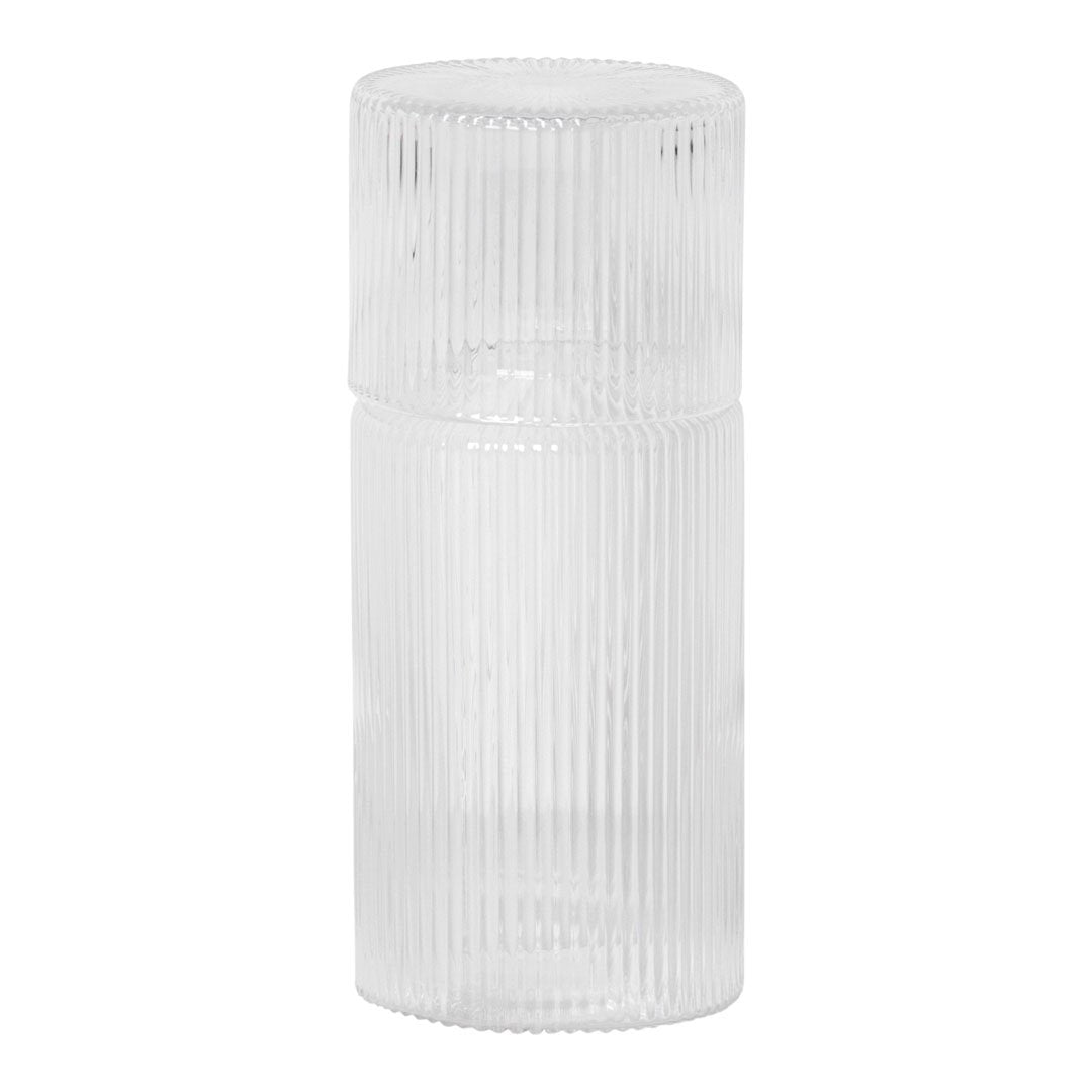 Clear glass container with vertical ribbed texture, ideal for stylish home decor or storage solutions.