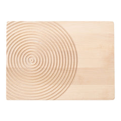 Natural wood cutting board with a smooth surface and concentric circle pattern in a light beige hue.